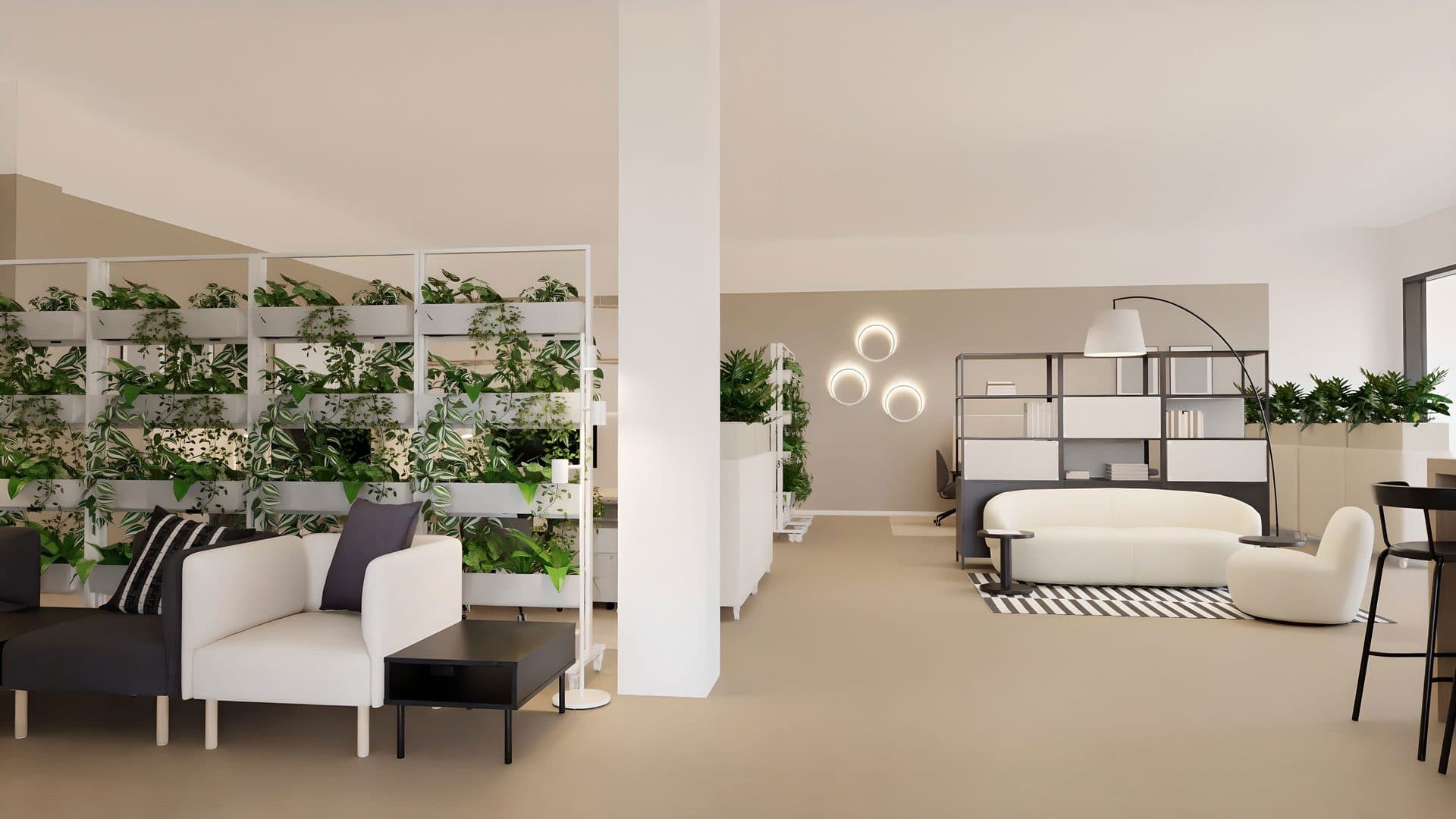 Loungebereich im innoLab mit Sofas, bepflanzten Raumteilern und offenem Arbeitsbereich